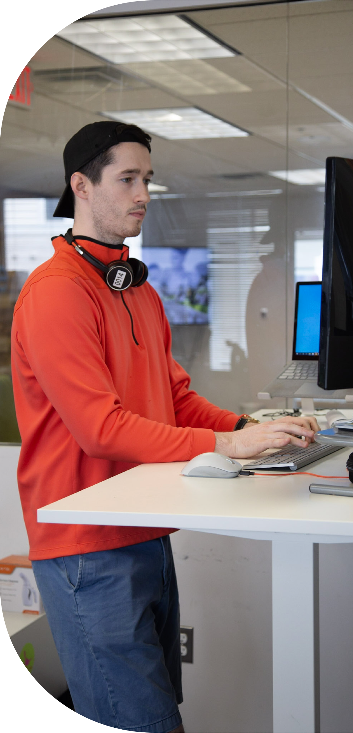 Image of Remine employee working at standup desk
